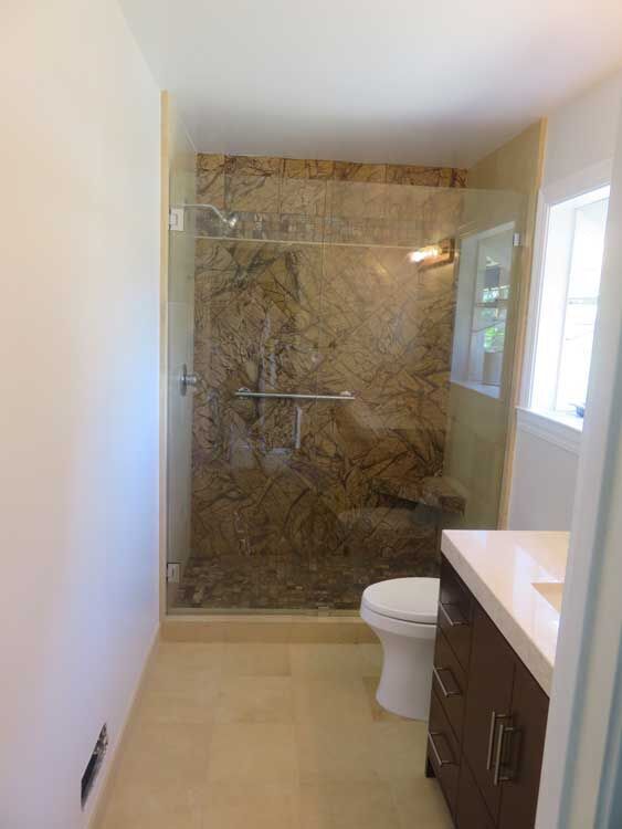 Marin County bathroom by Miconi Marble & Tile — frameless glass shower with stone (project 19)